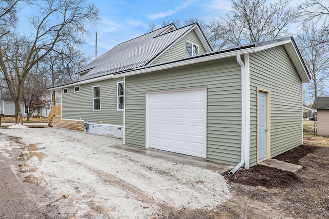 view of side of home featuring a garage