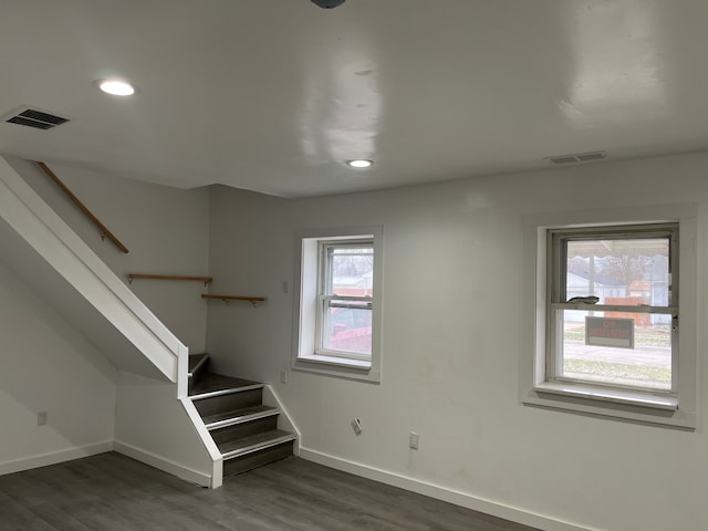 stairway featuring hardwood / wood-style flooring