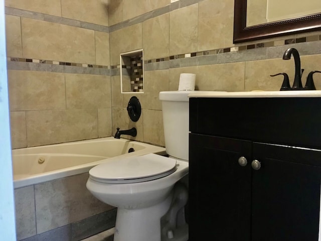 full bathroom featuring vanity, toilet, tile walls, and tiled shower / bath combo