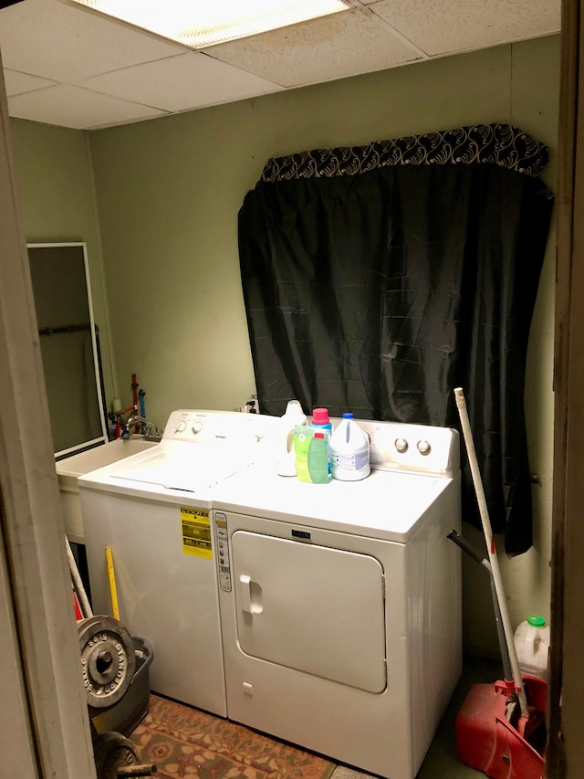 washroom featuring washer and dryer