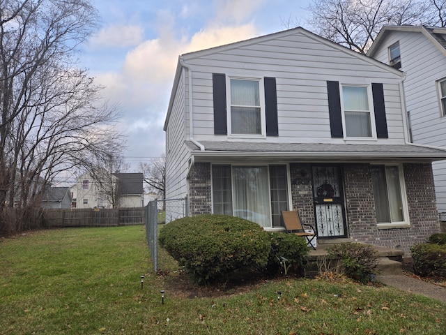 view of property featuring a front yard