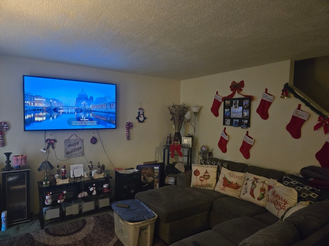 carpeted living room featuring a textured ceiling