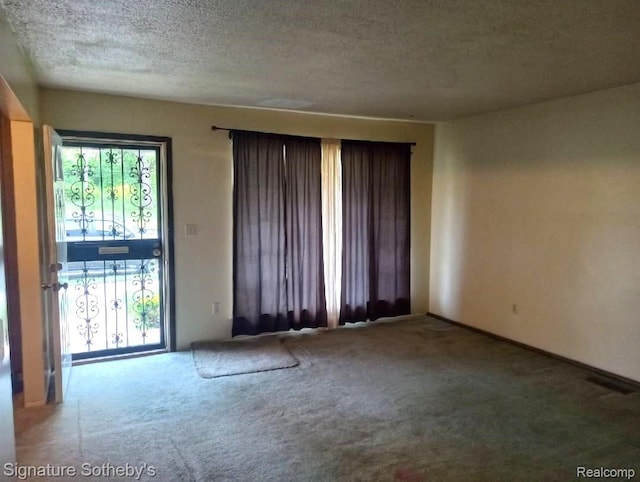 8240 Desoto St, Detroit, MI 48238 - spare room with carpet flooring and a textured ceiling