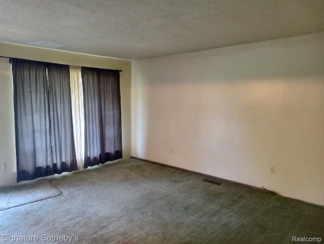 8240 Desoto St, Detroit, MI 48238 - carpeted spare room with a textured ceiling