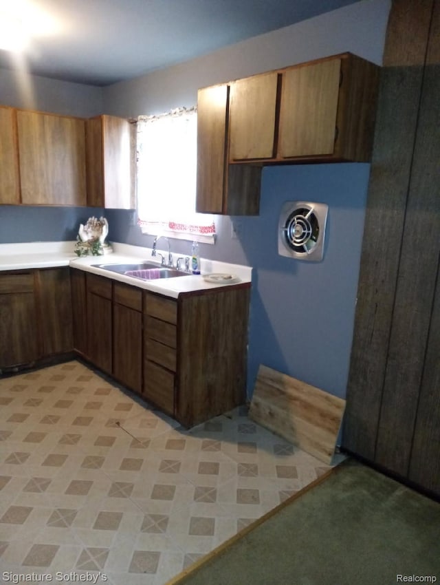 8240 Desoto St, Detroit, MI 48238 - kitchen featuring light countertops and brown cabinets
