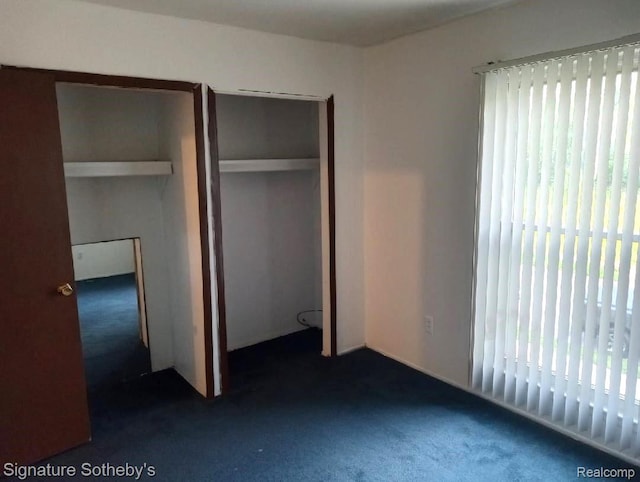 8240 Desoto St, Detroit, MI 48238 - unfurnished bedroom with dark colored carpet and a closet