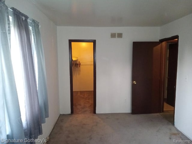 8240 Desoto St, Detroit, MI 48238 - unfurnished bedroom with carpet and a walk in closet