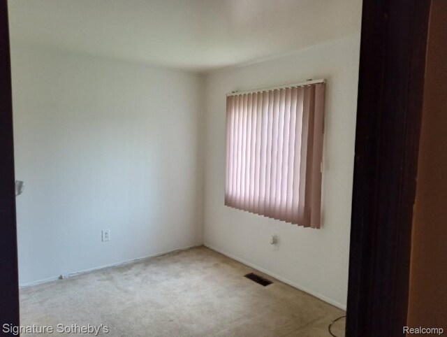 8240 Desoto St, Detroit, MI 48238 - spare room featuring carpet floors and baseboards