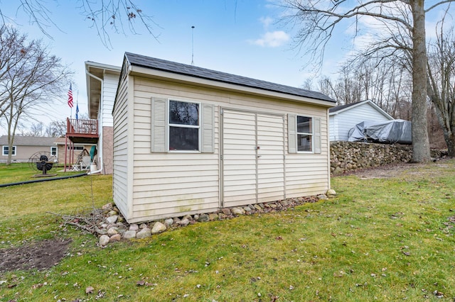 exterior space with a yard and an outdoor structure