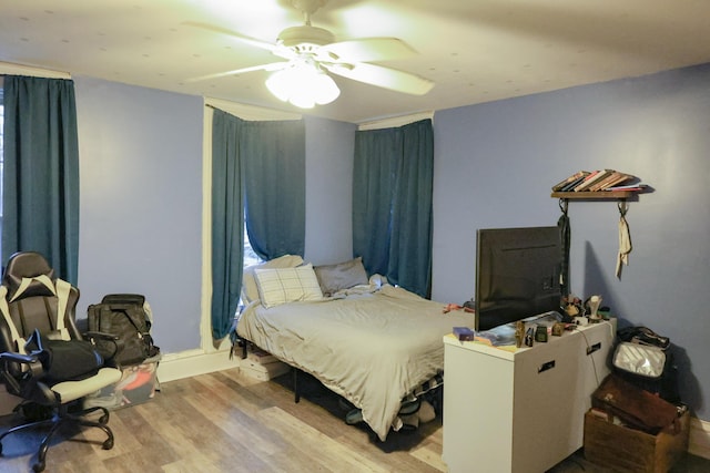 bedroom featuring ceiling fan and wood finished floors