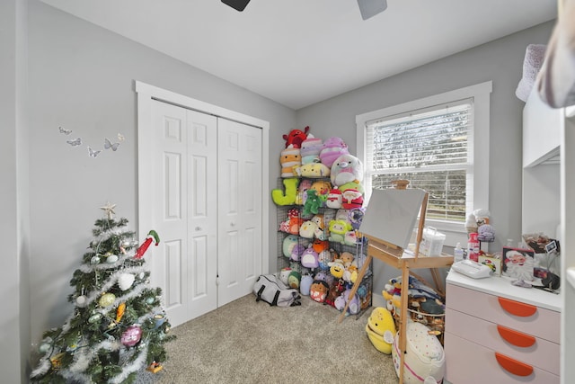 rec room featuring ceiling fan and carpet floors