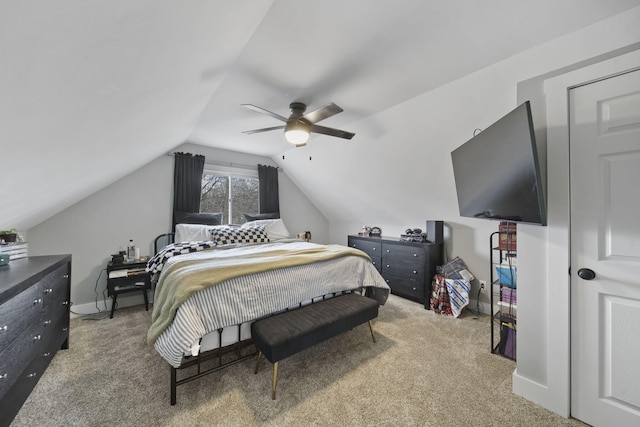 bedroom featuring carpet flooring, ceiling fan, and vaulted ceiling