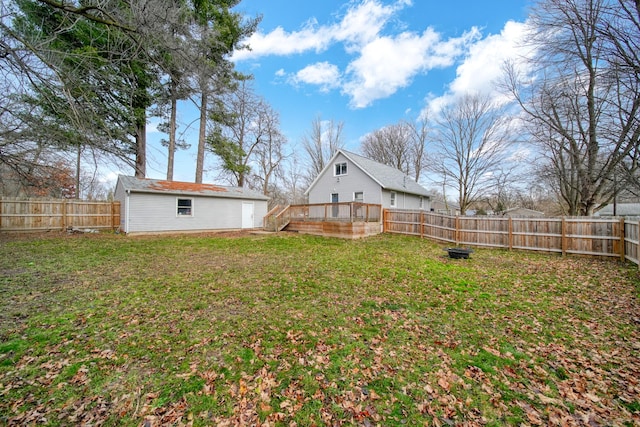 view of yard featuring an outbuilding and a deck