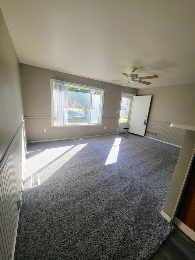 carpeted empty room with ceiling fan