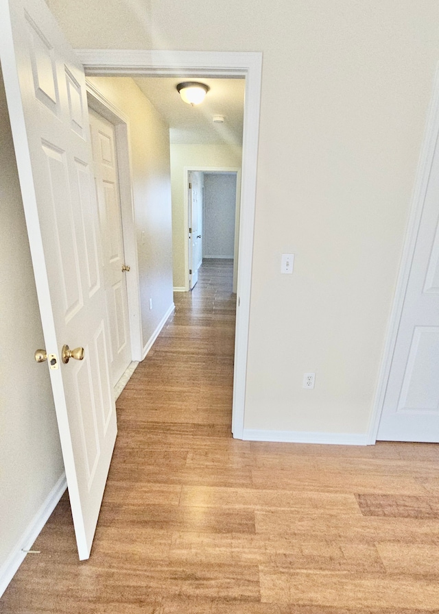 corridor featuring light hardwood / wood-style flooring