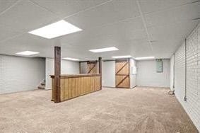 basement featuring carpet