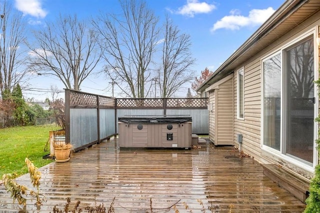 deck featuring a hot tub