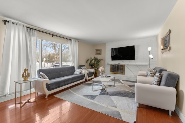 living room with a fireplace and hardwood / wood-style flooring