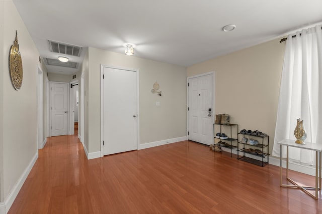 interior space with hardwood / wood-style floors