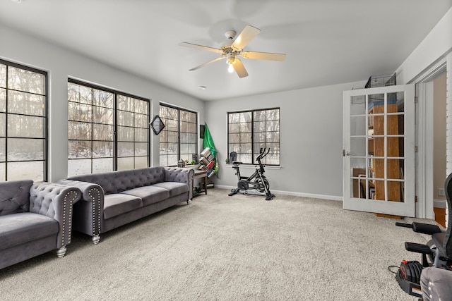 workout area with carpet and ceiling fan