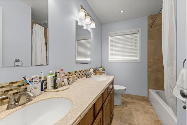 full bathroom featuring decorative backsplash, vanity, shower / tub combo, and toilet