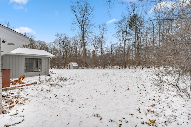 view of yard layered in snow