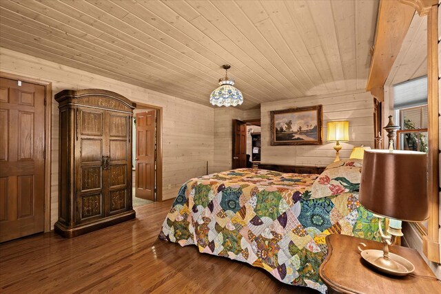 bedroom with wood ceiling, dark hardwood / wood-style flooring, and wood walls