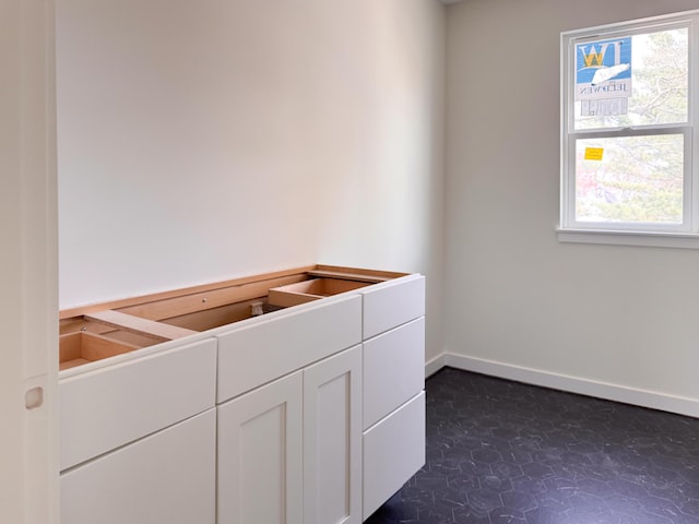 interior space with baseboards and plenty of natural light