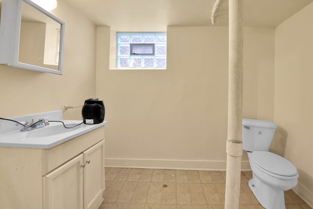 bathroom with tile patterned floors, vanity, and toilet