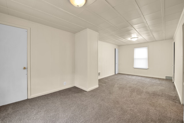 empty room with carpet flooring and crown molding