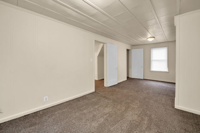 empty room with dark carpet