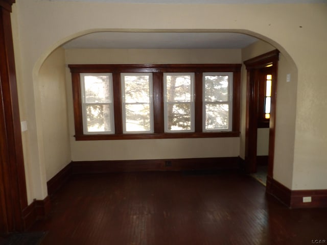 unfurnished room featuring dark hardwood / wood-style floors