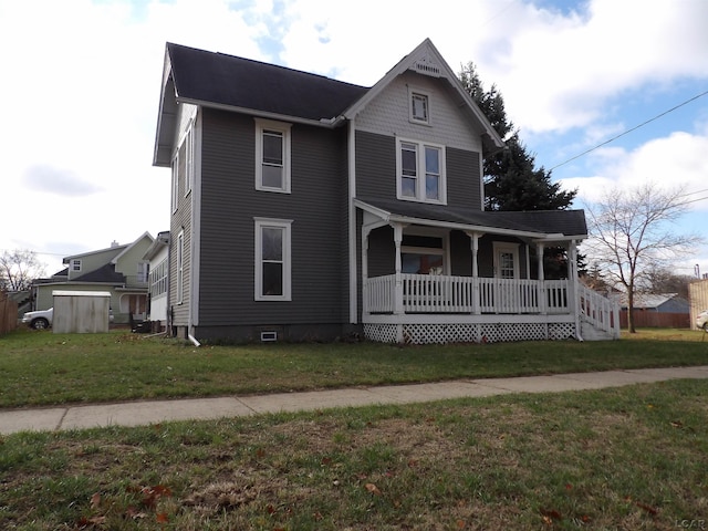 view of front of house with a front lawn and covered porch