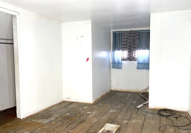 spare room with dark wood-type flooring