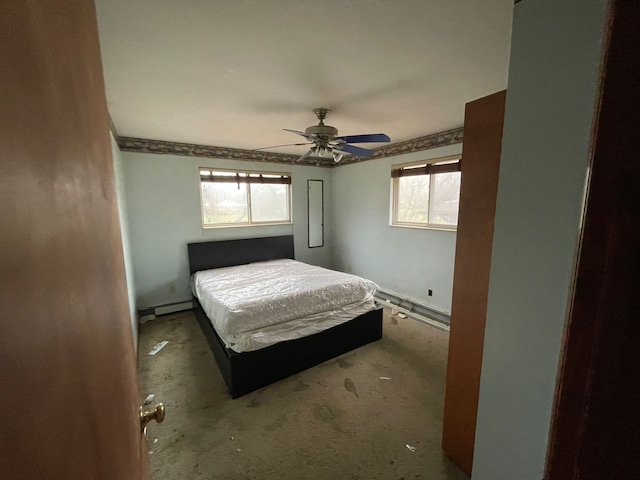 unfurnished bedroom with a baseboard radiator and ceiling fan