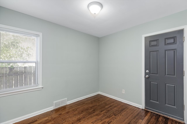 empty room featuring dark hardwood / wood-style floors