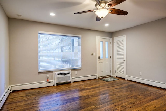 foyer entrance with dark wood-type flooring and a baseboard radiator