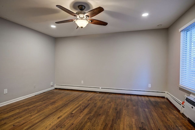 unfurnished room featuring ceiling fan, dark hardwood / wood-style flooring, and a baseboard radiator