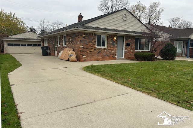 ranch-style home with a garage and a front lawn