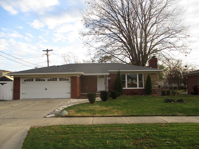 ranch-style home with a front lawn and a garage