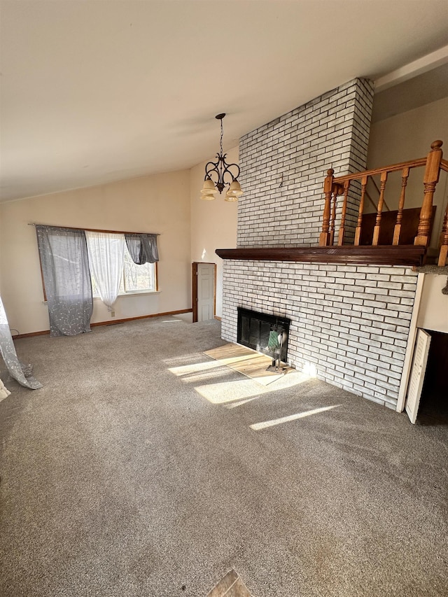 unfurnished living room featuring an inviting chandelier, vaulted ceiling, carpet flooring, a fireplace, and brick wall