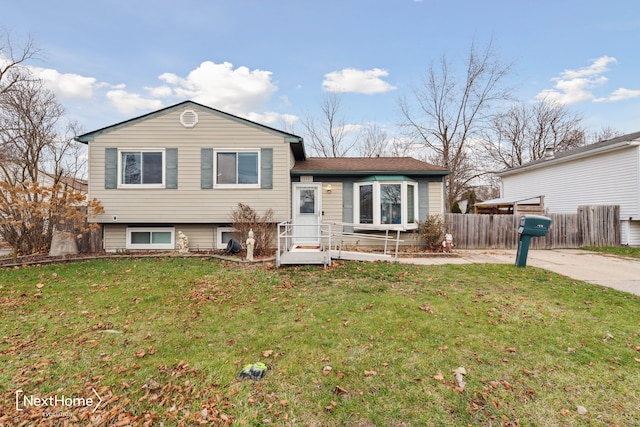 split level home with a front lawn