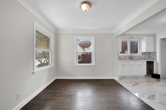 unfurnished dining area with sink