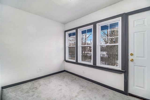 empty room featuring light colored carpet