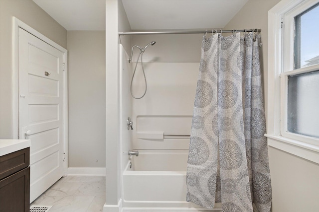 bathroom with shower / tub combo with curtain and vanity