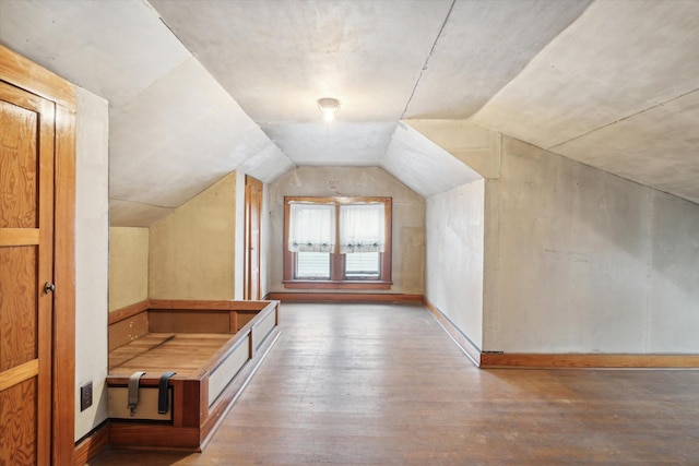 bonus room featuring hardwood / wood-style flooring and vaulted ceiling