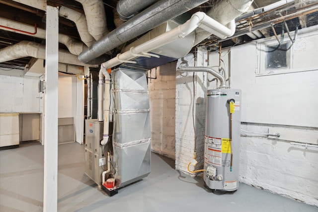 utility room featuring gas water heater and heating unit