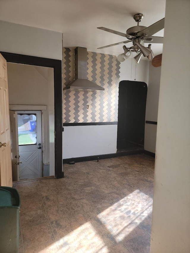 unfurnished living room featuring ceiling fan