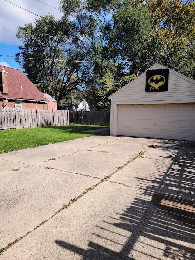 garage featuring a lawn