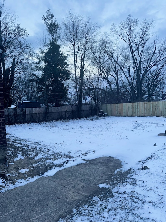 view of yard covered in snow